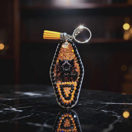 🐾 Powell Panther Pride Resin Keychain – Handmade Black & Orange Glitter Mascot Charm with Tassel Accent 🐾