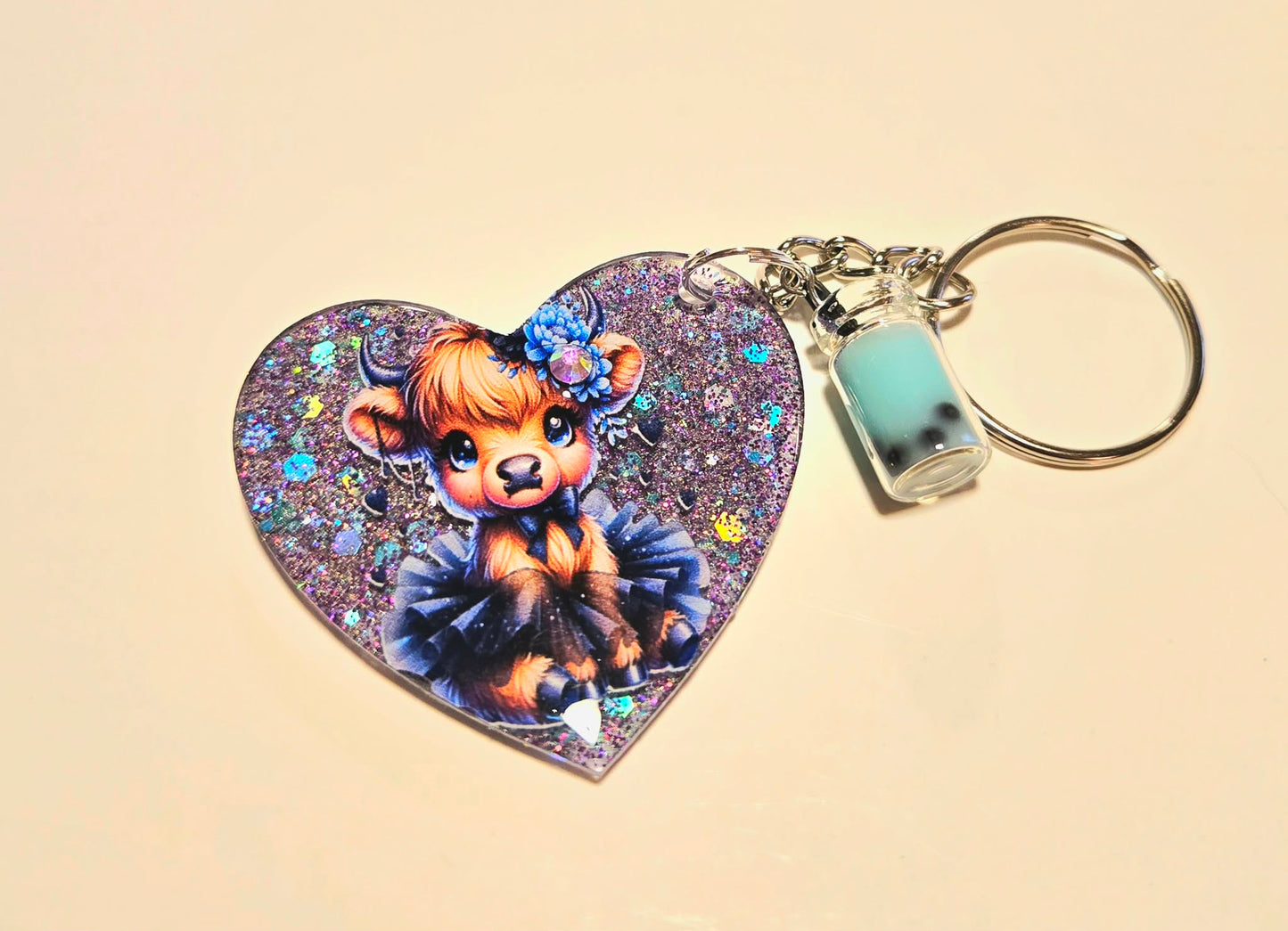 Cute Highland Cow Heart Resin Keychain – Purple Glitter Charm with Mini Boba Bottle
